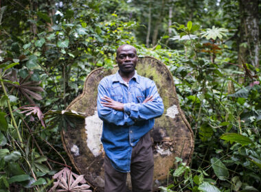 EUDR-deforestation-lumber-trade-cameroon-man-posing-tree